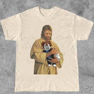 Jesus Holding Gamer TShirt | Goofy Ahh Weird Meme T Shirt, Weirdcore Cursed Shirt, Funny Brainrot Shitpost Shirt, Silly Stupid RBlox Cringe