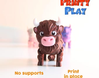 May include: A brown and white 3D printed toy Highland cow with a pink nose. The toy is standing on a white surface. The text "PRINTY PLAY" is in the upper right corner of the image. The text "No supports" is in the lower left corner of the image. The text "Print in place" is in the lower right corner of the image.