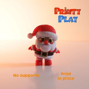 May include: A 3D-printed Santa Claus figurine. The figure is red, white, and black, with a red hat, white beard, and black belt. The text "Printy Play" is displayed in red and blue. The text "No supports" and "Print in place" are also visible.