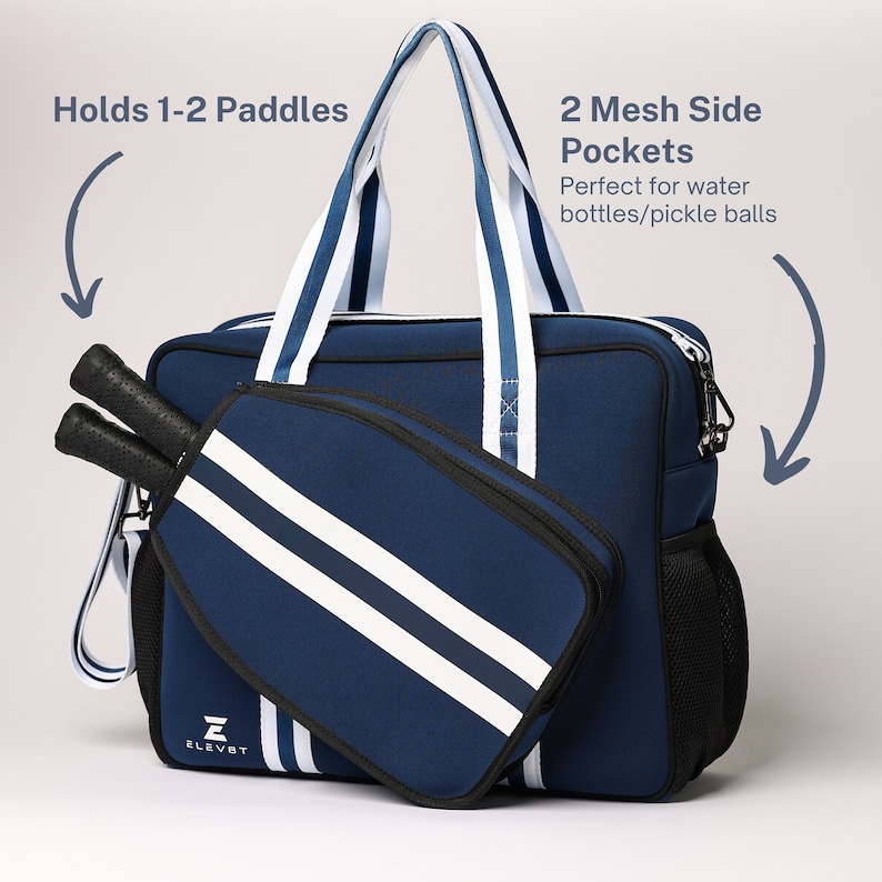 May include: A navy blue and white striped sports bag with a zippered pocket and two mesh side pockets. The bag has a padded compartment for holding 1-2 paddles. The bag is labeled "ELEVET".