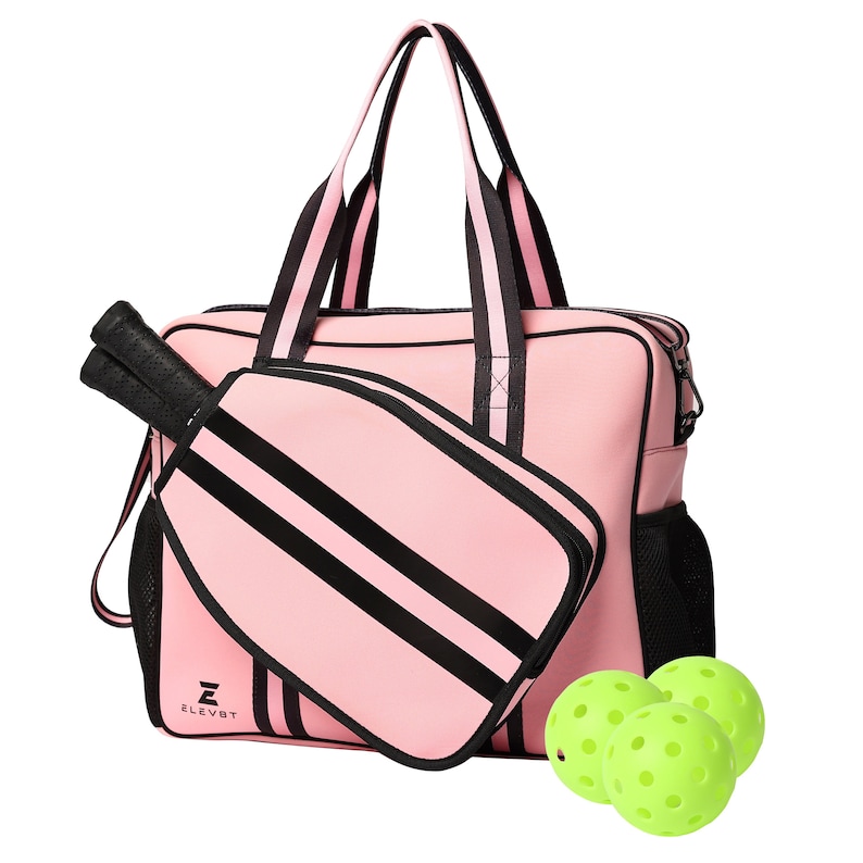May include: A pink and black  paddle ball bag with a black and white striped paddle and three lime green paddle balls. The bag has a black zipper and a black mesh pocket on the side. The bag has the text "ELEV8T" on the front.