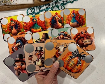 May include: A set of 10 Thanksgiving-themed coasters featuring various images of turkeys, pumpkins, and other fall-themed imagery. Each coaster has a white circle in the center, which can be used for personalization or as a place to put a drink.
