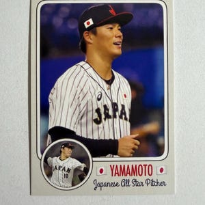 May include: Baseball card featuring a Japanese All Star pitcher, Yamamoto. The card shows the player in a pinstripe jersey with the word "JAPA" and a Japanese flag on the cap. A smaller image of the player is in the lower left corner.