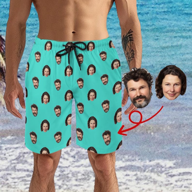May include: A pair of turquoise swim trunks with a repeating pattern of faces. The faces are of different people, some with beards and some with long hair.