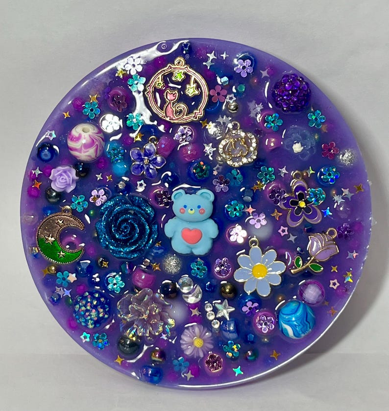Celestial Amethyst Picky Pad for Skin Picking & Stress Relief Close-Up of Bead-Filled Sensory Fidget Pad with Moon & Star Charms Silicone Picking Pad with Purple Galaxy Theme & Glitter Details Anxiety & Nail Biting Relief Picky Pad with Beads & Cosmic Accents Fidget Pick Pad for ADHD, OCD & Astrology Lovers