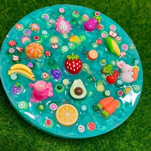 Farmers Market Picky Pad for Skin Picking & Stress Relief, Close-Up of Bead-Filled Sensory Fidget Pad with Fruit & Veggie Charms, Silicone Picking Pad with Farm Colors & Scented Berry Infusion, Anxiety & Nail Biting Relief Picky Pad with Beads & Farm-Fresh Accents, Fidget Pick Pad for ADHD, OCD & Farmers Market Lovers, beads, stimming, skin picking pad, ocd, fine motor activity, picking toy, fruit sensory toy, scented fidget, farm-themed fidget