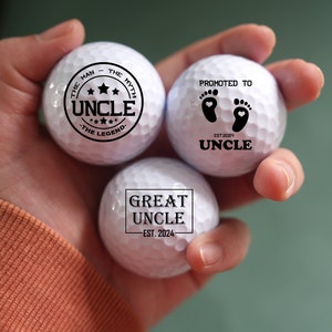 May include: Three white golf balls with black text. The first golf ball says "The Man - The Myth - Uncle - The Legend". The second golf ball says "Promoted to Uncle Est. 2024". The third golf ball says "Great Uncle - Est. 2024".