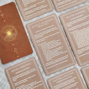 May include: A collection of rectangular cards with a terracotta background and white text. The cards feature titles such as Spirit Guide Letter Writing, Energy Scanning Practice, Water Scrying, Angel Card Pull, and Mantra Chanting, with detailed instructions and affirmations for each spiritual exercise.