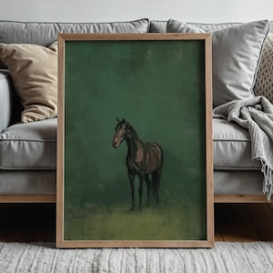 May include: A framed art print featuring a brown horse against a green background. The horse is depicted in a realistic style, with detailed shading and a natural pose. The frame is made of light-colored wood, adding a touch of warmth.
