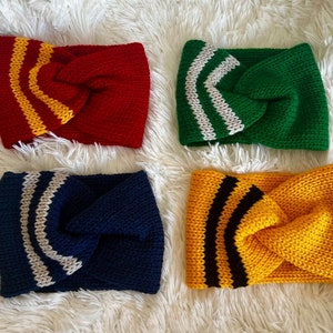 May include: Four knitted headbands in different colors with contrasting stripes. The headbands are red with yellow stripes, green with white stripes, navy blue with white stripes, and yellow with black stripes.