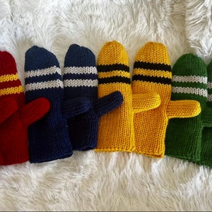 May include: Five pairs of knitted mittens in different colors, each with two stripes of a contrasting color. The colors are red, navy blue, yellow, green, and a combination of black and yellow.