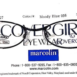 May include: Moody Blue CoverGirl eyeglasses with a black frame. The glasses have a spring hinge and stainless steel components. The text "COVERGIRL EYEWEAR" is printed on the lenses. The frame size is 49/18/135.