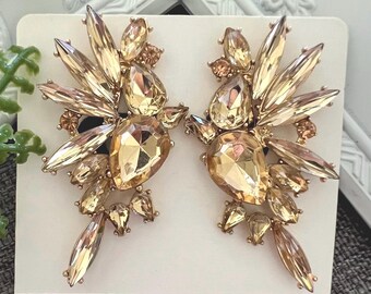 Pendientes de clip con diamantes de imitación: Guiño de cristal, para orejas sin perforar.