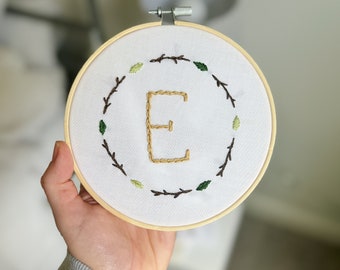 Embroidered custom letter with twigs and leaves