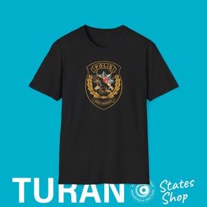 May include: Black t-shirt featuring a gold and black emblem with an eagle and the text "POLIS" and "OZEL HAREKAT". The shirt also has the word "TURAN" printed at the bottom.