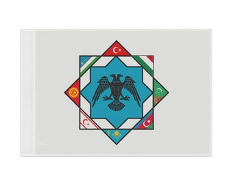 May include: A white flag with a blue star and a black double-headed eagle in the center. The star is surrounded by eight smaller stars representing the flags of Turkey, Azerbaijan, Kazakhstan, Kyrgyzstan, Turkmenistan, Uzbekistan, and the Turkish Republic of Northern Cyprus.