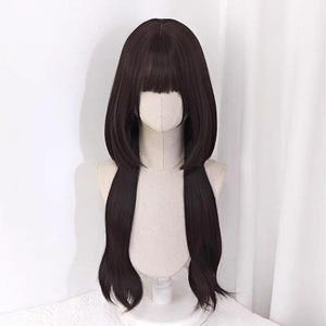かわいい女の子スタイルの黒のクラシックウィッグ、かわいいロールプレイの高温シルクウィッグ、黒のクラゲの頭の短い長い髪のウィッグ
