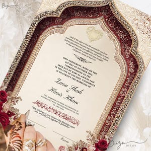 May include: An ornate wedding certificate with a burgundy and gold design. The document includes text in English and Arabic, with the names Zara Shah and Haris Khan. Floral accents and a heart-shaped design are visible.