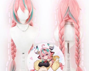 May include: A pink wig with long, braided pigtails and teal highlights. The wig is displayed on a white mannequin head. A circular illustration of a cartoon character with pink hair and horns is in the foreground.