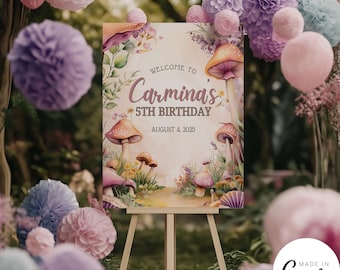 May include: A welcome sign for a 5th birthday party with a whimsical mushroom theme. The sign features a watercolour illustration of mushrooms, flowers, and a path leading into a forest. The text reads "Welcome to Carmina's 5th Birthday August 4, 2025".