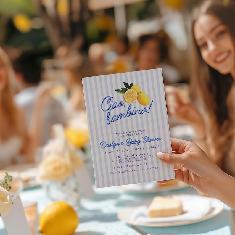 May include: A blue and white striped baby shower invitation with a lemon illustration and the text "Ciao bambino!"  Join us for brunch as we celebrate Darlyn's Baby Shower. 04 Oct 25 | Saturday | 11:30am. The Garden Oasis, 113 Blooming Boulevard, Heights, Roseville, NY. RSVP with Marc 123-444-5555. Wear your best Italian summer outfit!