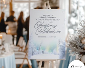 May include: A white sign on a wooden easel, with the text "Welcome to Stan & Charlotte's Winter Wonderland Christmas Celebration December 4 | New York." The sign features a winter landscape illustration with trees and a colorful sky.