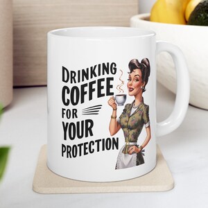 Ceramic Mug with Retro Vintage Woman, Funny Design - Gift for Coffee Lovers - ‘Drinking Coffee for Your Protection’