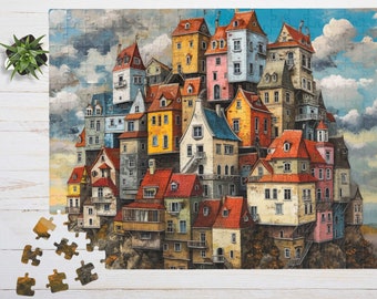 Könnte beinhalten: Ein Puzzle, das eine dichte Ansammlung von bunten Häusern mit roten Dächern auf einer felsigen Klippe unter einem bewölkten Himmel zeigt. Mehrere Puzzleteile liegen verstreut in der unteren linken Ecke und eine kleine Sukkulente steht daneben.