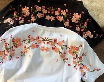 Amerikanische Kurzarm-T-Shirts für Männer und Frauen sind lose, lässige Oberteile mit Pflaumenblüte und Rundhalsausschnitt