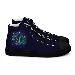 May include: High-top sneakers with a black canvas upper and black laces. The shoes feature a green, blue, and yellow marijuana leaf design in a circle on the side.