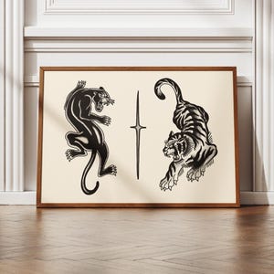 May include: A framed print featuring black panther and tiger illustrations. The panther is depicted leaping, while the tiger is roaring. A vertical cross-like design is between the animals. The artwork is set against a cream background.