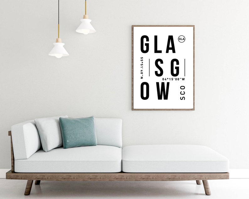 May include: Black and white typography print with the word "GLASGOW" in large letters. The print also includes the coordinates "55&deg;51&prime;40&Prime;N 04&deg;15&prime;00&Prime;W" and the abbreviations "GLA" and "SCO".