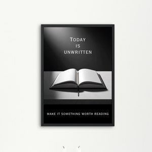 May include: Black and white framed print with the text "TODAY IS UNWRITTEN" and an open book with the text "MAKE IT SOMETHING WORTH READING" below the book.