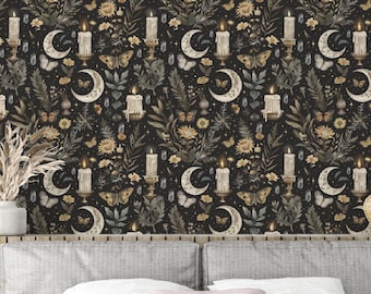 May include: A dark background with a repeating pattern of candles, moons, butterflies, and floral elements. The pattern is in shades of gold, white, and brown. The background is behind a grey headboard and a bed with white bedding.