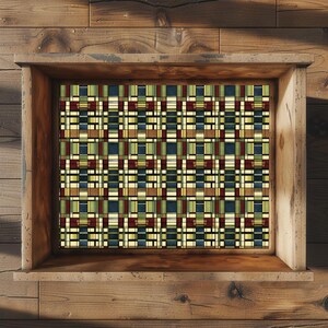 May include: A rectangular wooden frame containing a flat panel with a repeating geometric grid pattern. The design features intersecting vertical and horizontal lines in shades of dark red, forest green, navy blue, and cream, creating a structured, multi-colored plaid-like aesthetic.