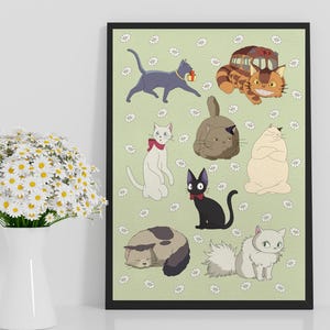 May include: A framed art print featuring cartoon cats in various poses on a light green background with white daisy accents. The cats are in shades of gray, black, white, and tan. The print is displayed on a white surface.
