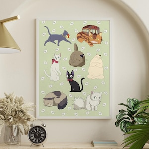 May include: A framed art print featuring cartoon cats in various poses on a light green background with white flower accents. The cats are in different colors, including gray, black, white, and orange. The print is displayed on a wooden shelf with a clock and vase.