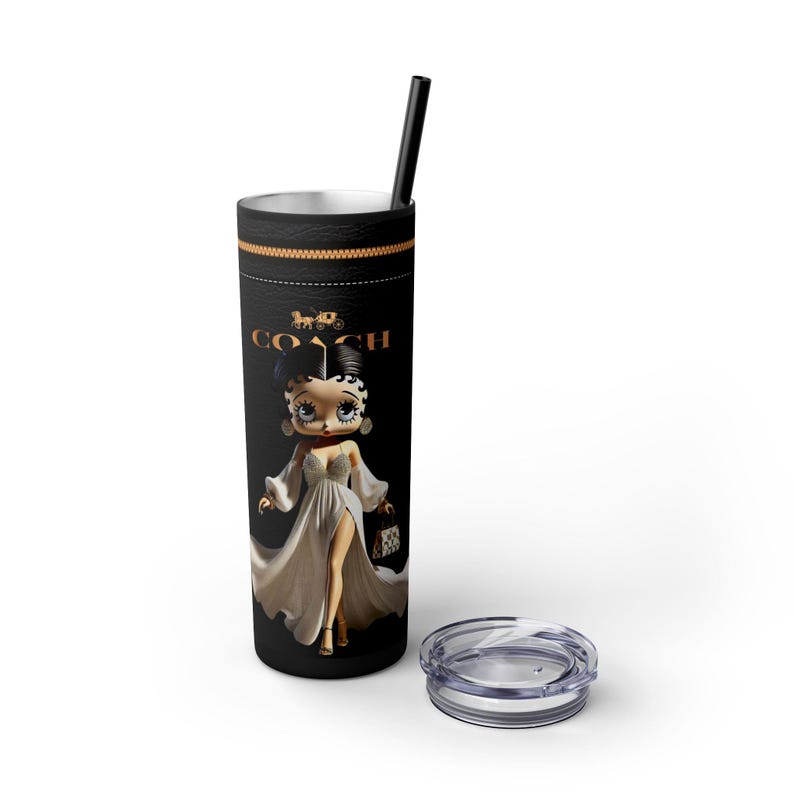May include: A black and gold stainless steel tumbler with a cartoon image of a woman in a white dress and the word "COACH" printed on it.