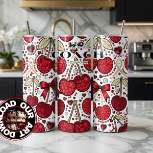 May include: Three white tumblers with a cherry pattern, red bows, and gold accents. The center tumbler features the "COACH NEW YORK" logo. Each tumbler has a silver straw.