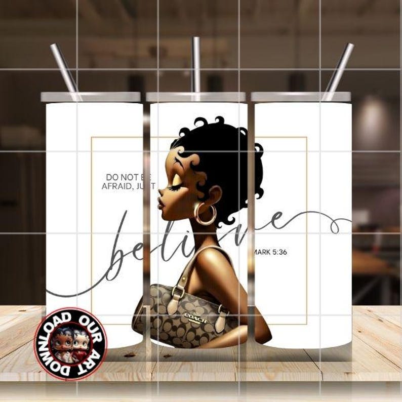 May include: White tumbler with a black illustration of a woman with gold hoop earrings and a Coach handbag. The tumbler has a silver lid and straw. Text on the tumbler reads "Do not be afraid, just believe" and "Mark 5:36".