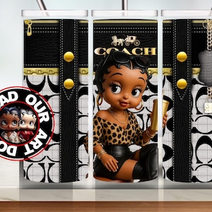 May include: A tumbler featuring a cartoon woman with a leopard print top and black leather skirt. The tumbler has a black and white pattern with gold accents and the Coach logo. The words "DOWNLOAD OUR ART" are on a circular sticker.