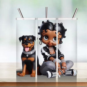 May include: Three stainless steel tumblers with a white background. The tumbler on the left features a black and brown Rottweiler dog. The tumblers on the right feature a cartoon of a Black woman with large eyes and black hair wearing a black and white jacket, gray pants, and white sneakers. The woman is sitting with her legs crossed.