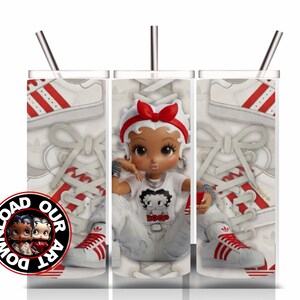 May include: A white tumbler with a stainless steel straw features a cartoon doll wearing a red bow and a white t-shirt with the text "BOOP". The design includes red and white sneakers and the text "DOWNLOAD OUR ART".