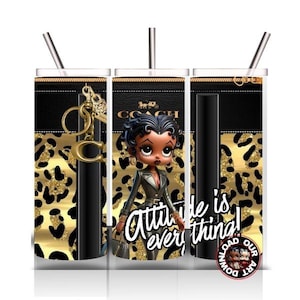 May include: Tumbler with a black and gold leopard print design, featuring a cartoon character and the text "Attitude is everything!". Includes a gold-colored charm and a silver straw.