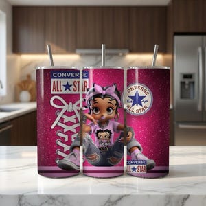 May include: A set of three stainless steel tumblers with lids and straws. The tumblers feature a pink glitter background with a cartoon Betty Boop character wearing a pink shirt and blue jeans. The tumblers also have the Converse All Star logo.