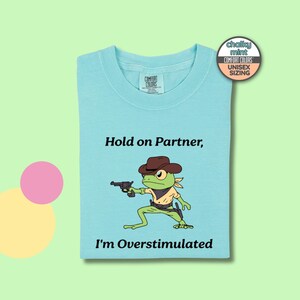 Overstimulated Shirt, Hold On Partner I&#39;m Overstimulated Cowboy Frog Meme Shirt, Unisex Comfort Colors® 1717 Shirt