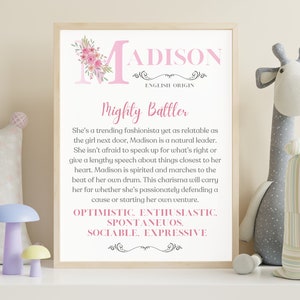 May include: A pink and white printable nursery art print with the name Madison in pink lettering and a floral design. The print includes the text "English Origin" and "Mighty Battler". The print also includes a list of personality traits: "Optimistic, Enthusiastic, Spontaneous, Sociable, Expressive."