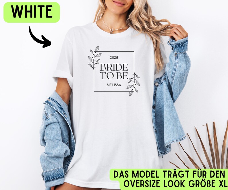 May include: White t-shirt with a black and white graphic that says "2025 Bride to Be Melissa". The graphic is in a square frame with a floral design.