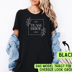 May include: Black t-shirt with white text and floral design. The text reads "2025 Team Bride Sophia".