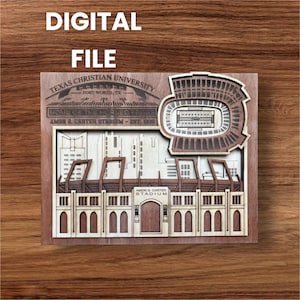 May include: A wooden laser-cut relief of the Amon G. Carter Stadium, home of the TCU Horned Frogs, with the text "DIGITAL FILE" at the top. The stadium is depicted in detail, with the text "TEXAS CHRISTIAN UNIVERSITY" and "FORT WORTH, TX" visible.